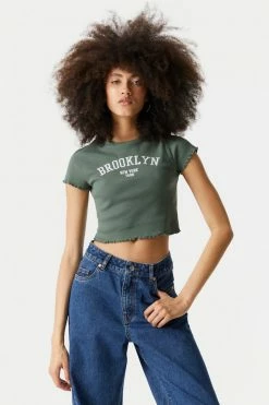 Stitches Ladies Tops Embroidered Brooklyn Graphic Lettuce Hem Cropped T-Shirt